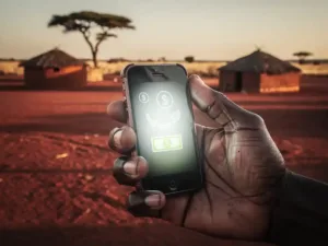 Weathered hand holding a mobile phone with a money transfer confirmation in an African savanna village at golden hour.